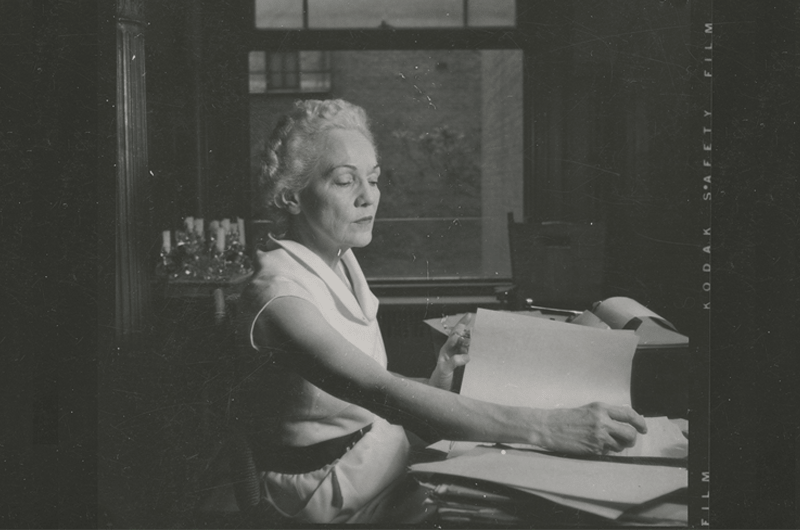 Katherine Anne Porter sitting at a typewriter