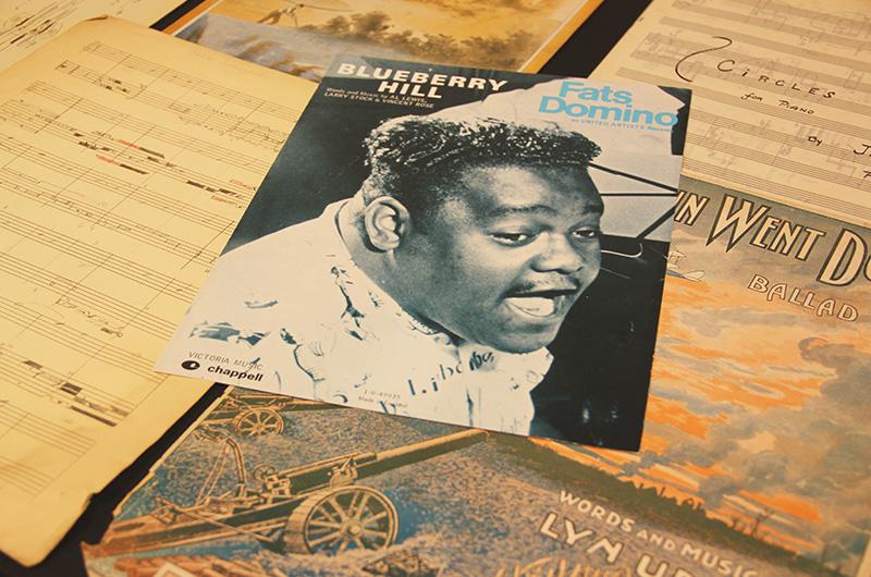 photo of a stack of sheet music focused on Blueberry Hill by Fats Domino