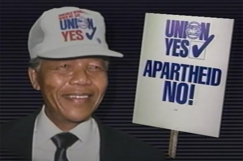 Nelson Mandela with a pro-Union and anti-apartheid hat and sign