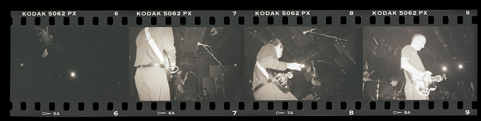 Positive film strip of photographs from a Chisel and Fugazi concert