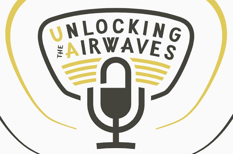 part of the logo for Unlocking the Airwaves featuring a microphone with sound waves radiating out