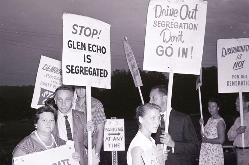 White protesters hold anti-segregation signs at Glenn Echo Park circa 1960