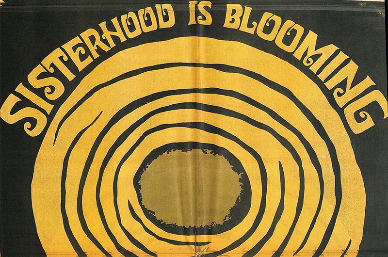 a section of a poster reading "Sisterhood is Blooming"